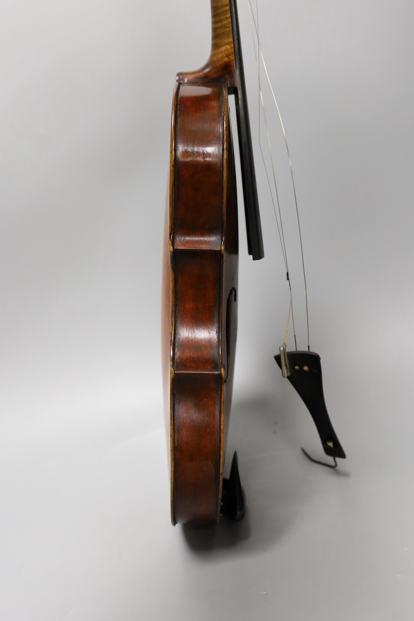 A violin labelled 'Albani Palermo', cased, length of back 35.5cm
